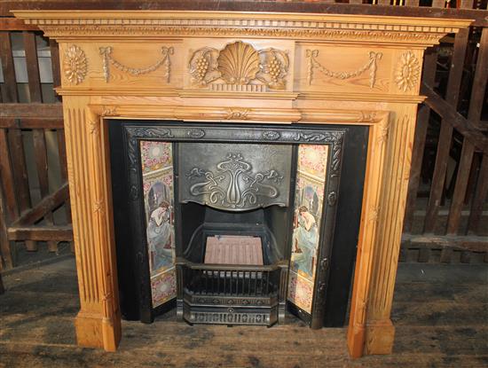 Tiled cast iron fire insert with pine surround